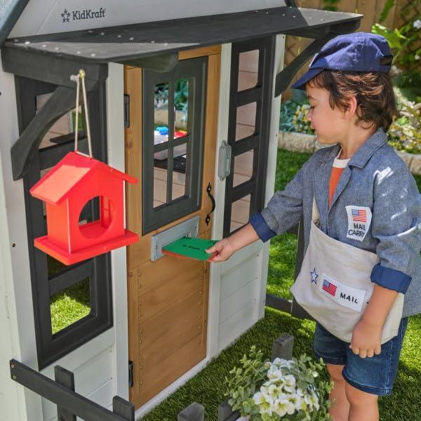 KidKraft Riverscape Wooden Playhouse with Working Doorbell, Fence, Kitchen and Pet Door - Unique Gift Market