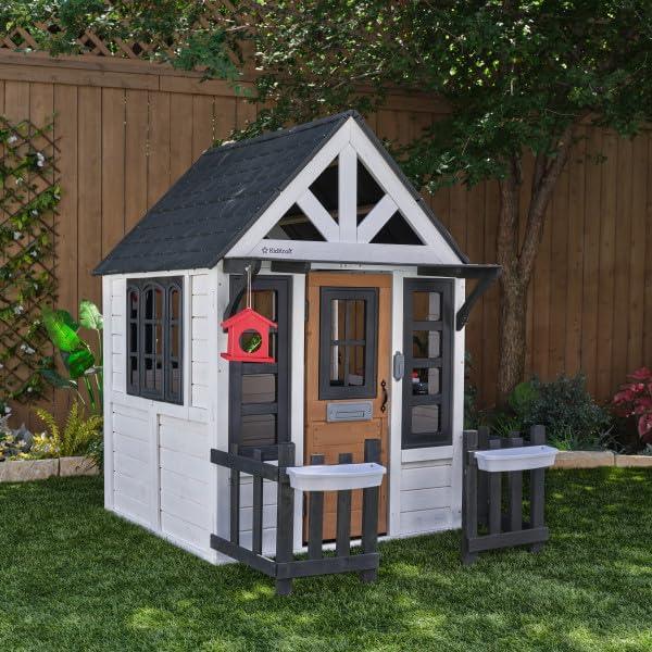 KidKraft Riverscape Wooden Playhouse with Working Doorbell, Fence, Kitchen and Pet Door - Unique Gift Market
